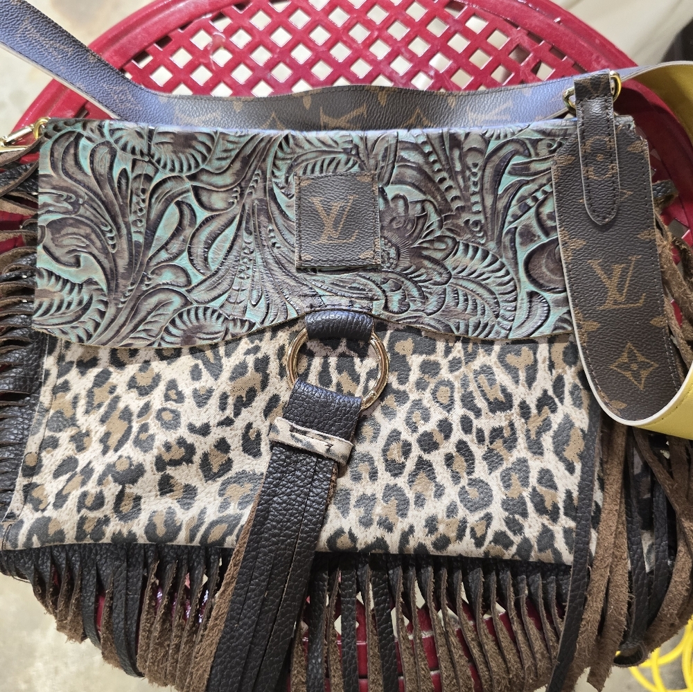 Louis vuitton accented leather cross body.